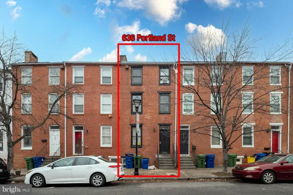 a car parked in front of a building
