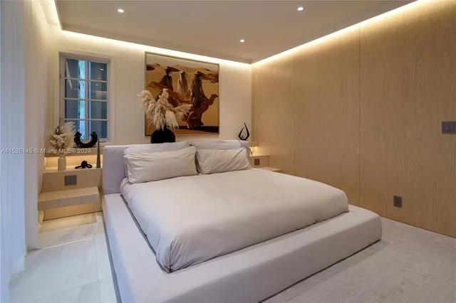 a bedroom with a bed and a walk in closet