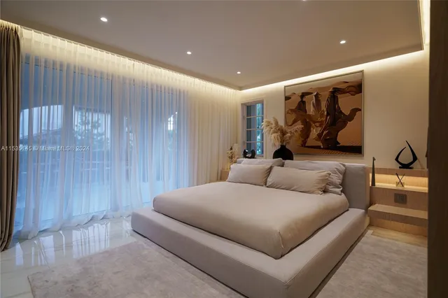 a hotel room with a large bed and furniture