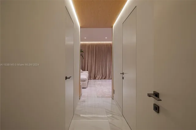 a living room with furniture and potted plant