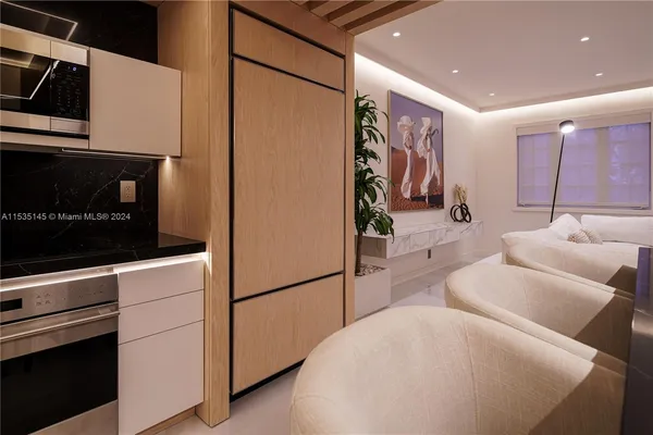 a hallway with a couch and a stove top oven