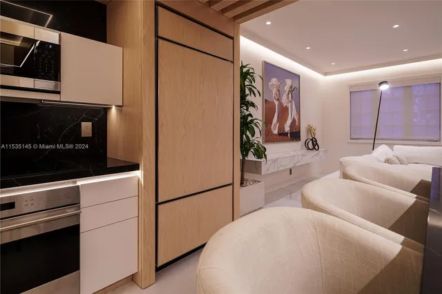 a hallway with a couch and a stove top oven