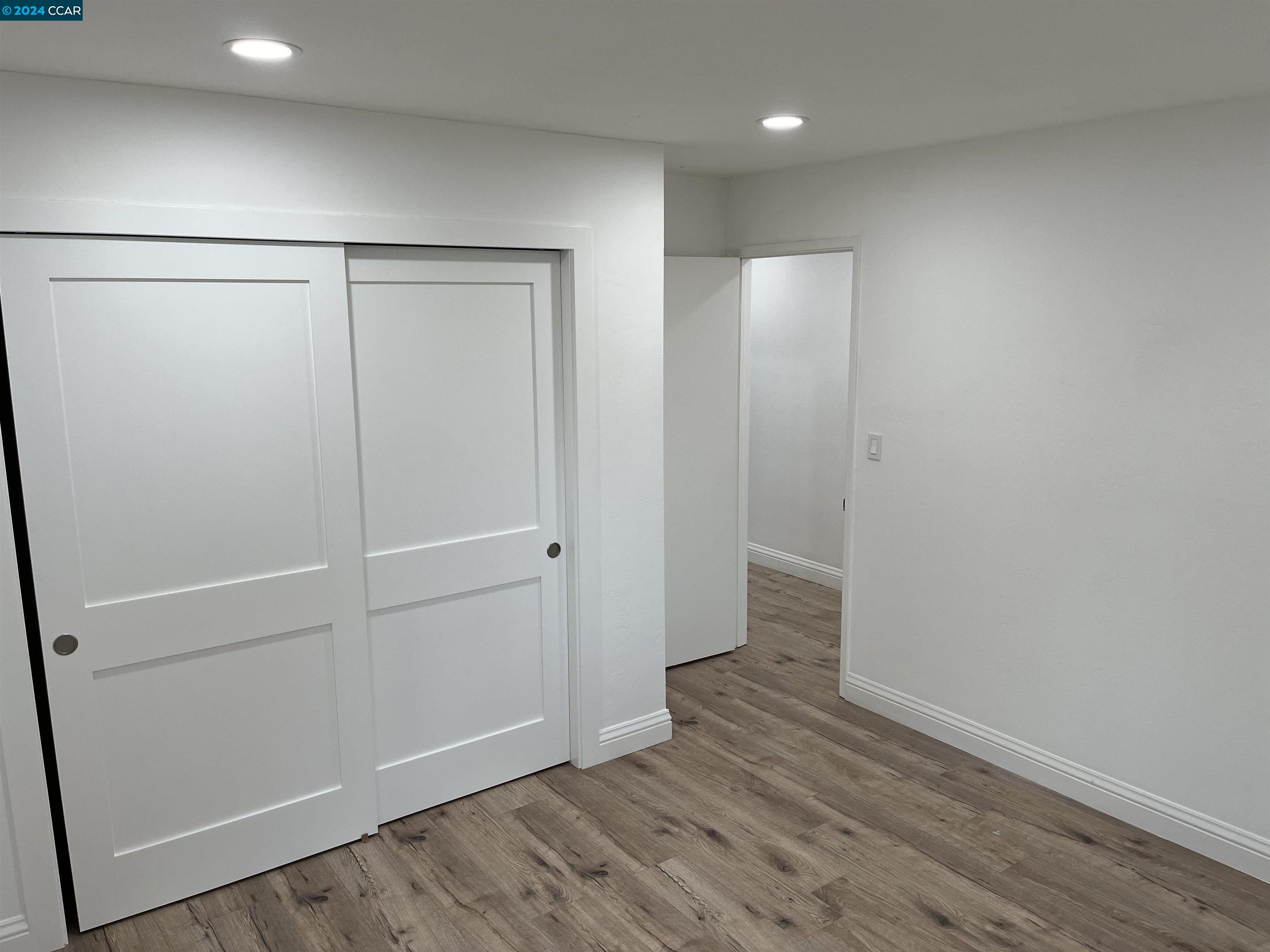 Glengarry Drive Walnut Creek, CA 94596 - Photo 16 of 21 an empty room with wooden floor