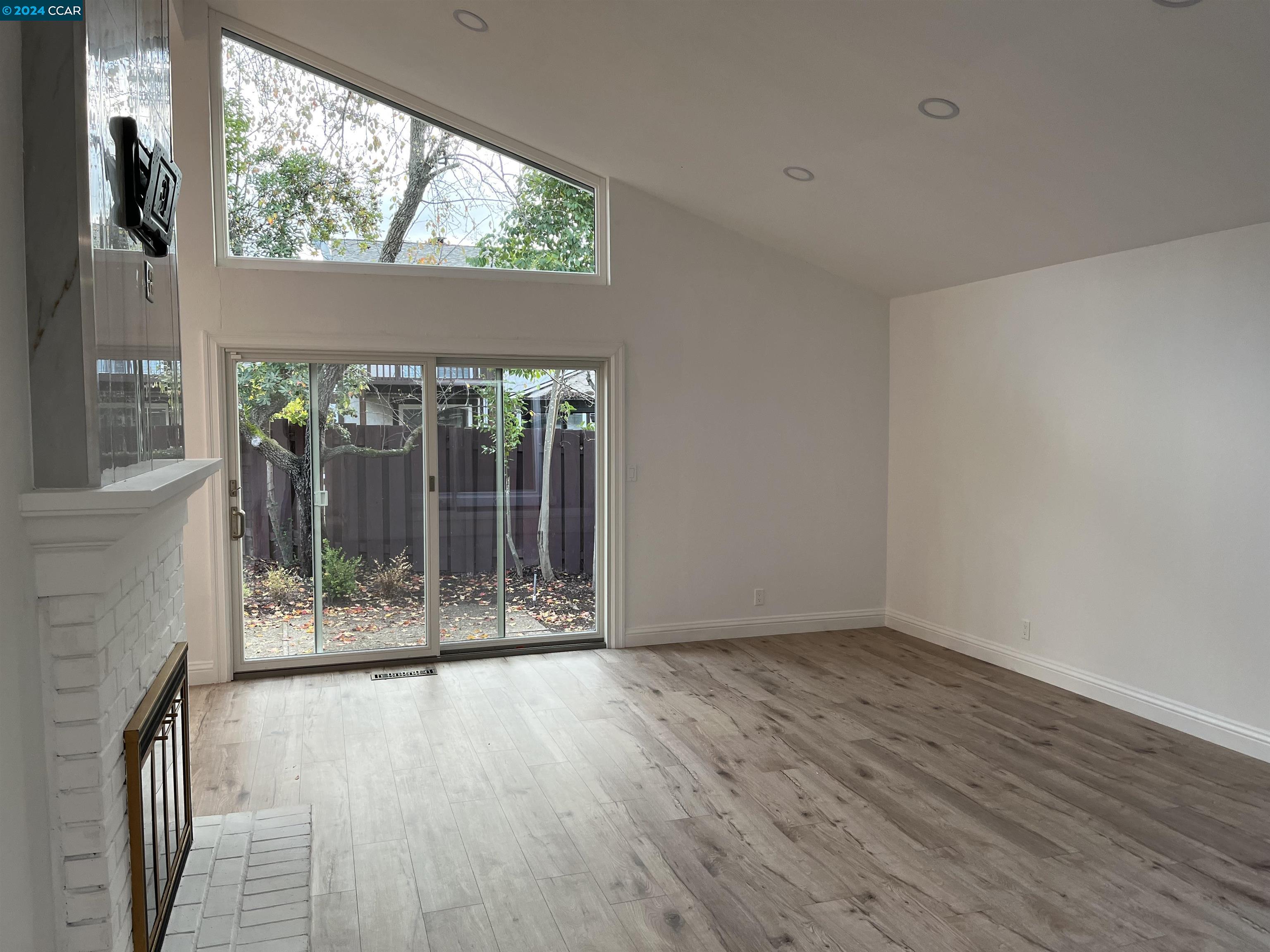Glengarry Drive Walnut Creek, CA 94596 - Photo 8 of 21 a view of an empty room with wooden floor and a window