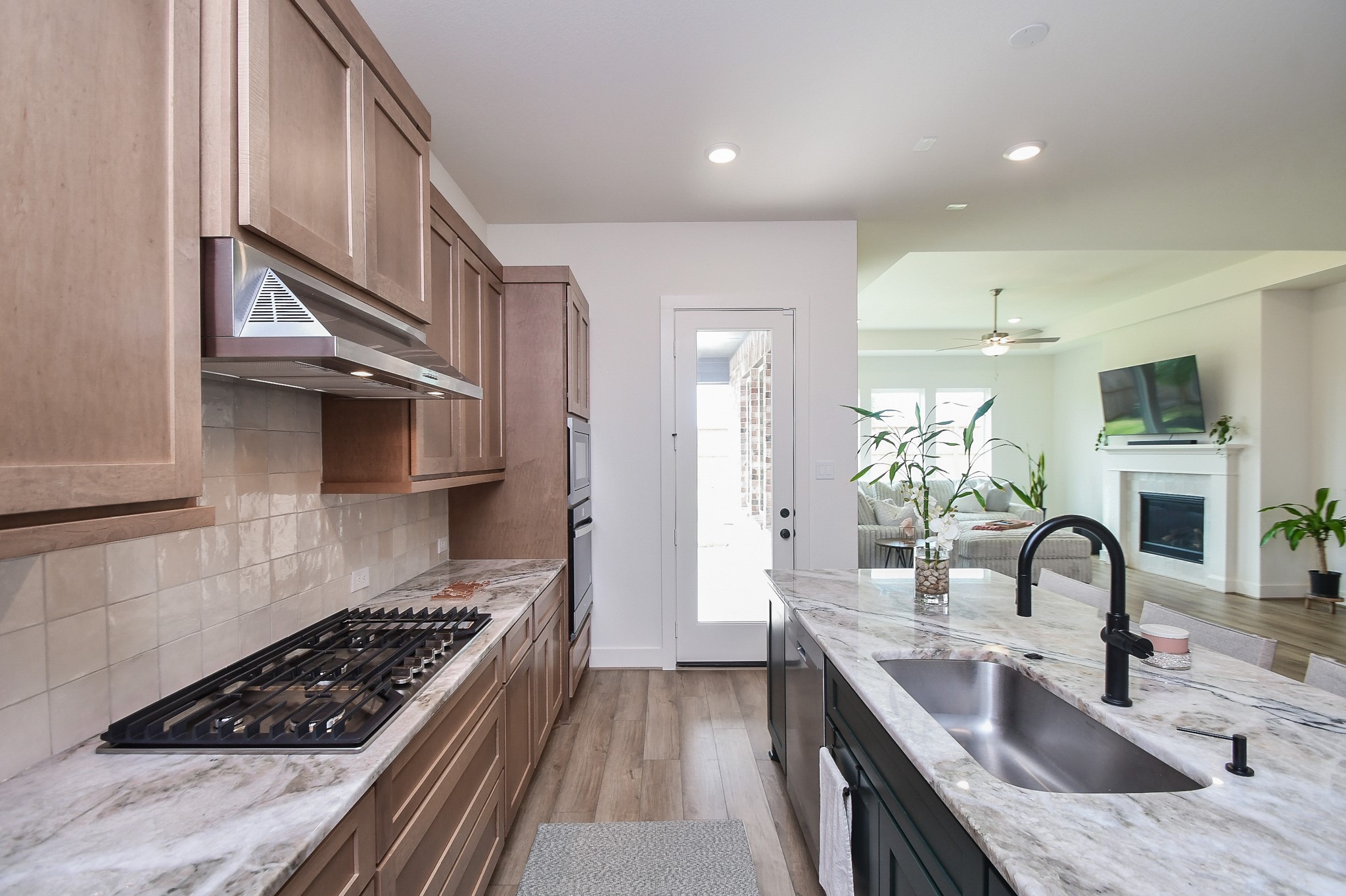 31915 Sky Rdg Lane Fulshear, TX 77441 - Photo 19 of 38 Well-designed kitchen presenting convenience and timeless style with its thoughtfully crafted cabinetry, stainless steel appliances, and generous room space.