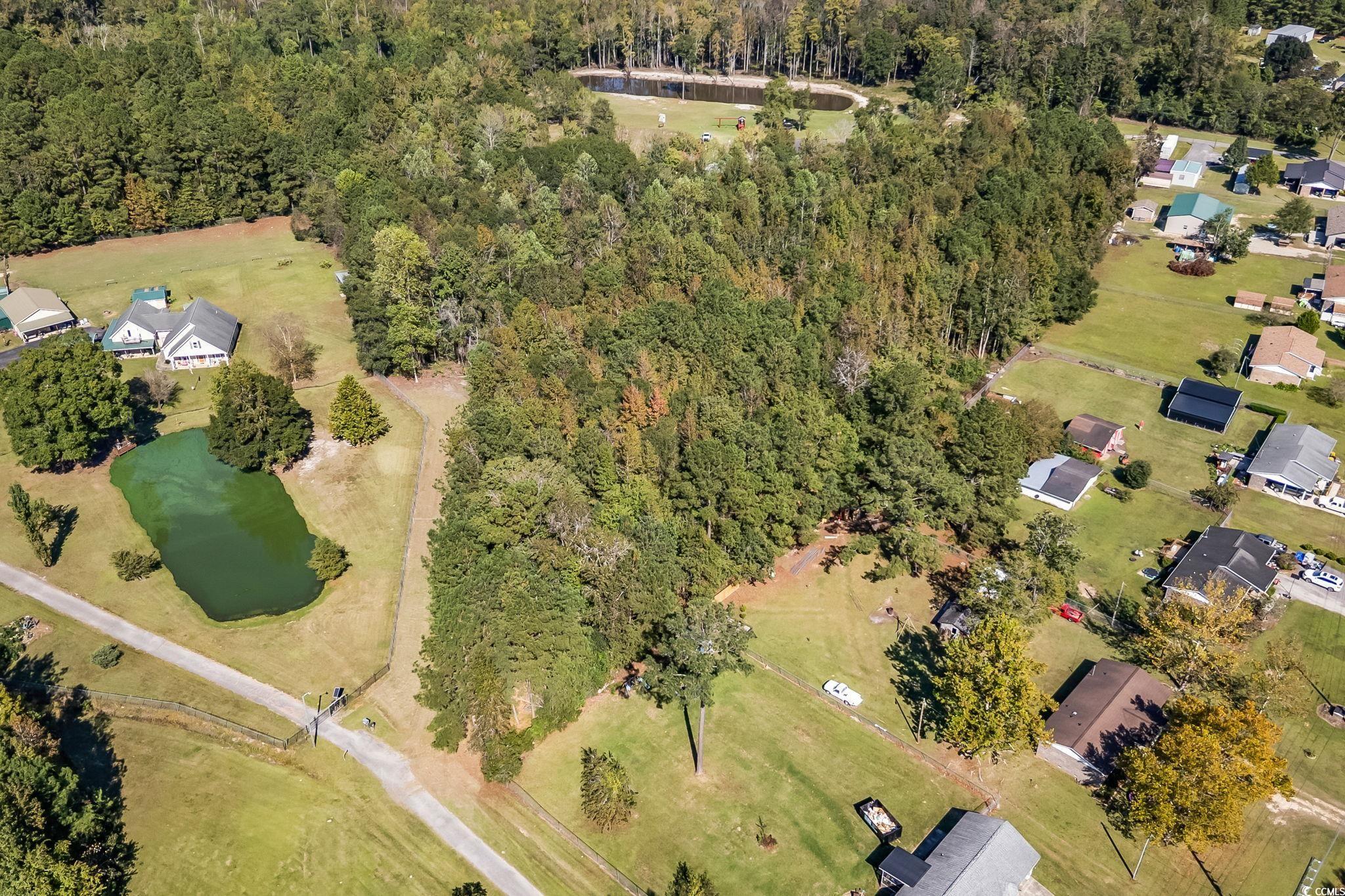 472 Highway 472 Conway, SC 29526 - Photo 2 of 30 Aerial overview of property's location with a nearby body of water and nearby suburban area