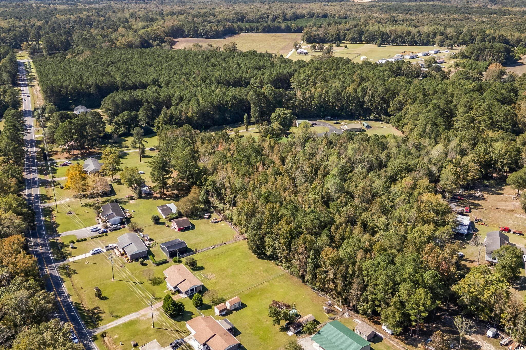 472 Highway 472 Conway, SC 29526 - Photo 23 of 30 Aerial view of property and surrounding area with a forest