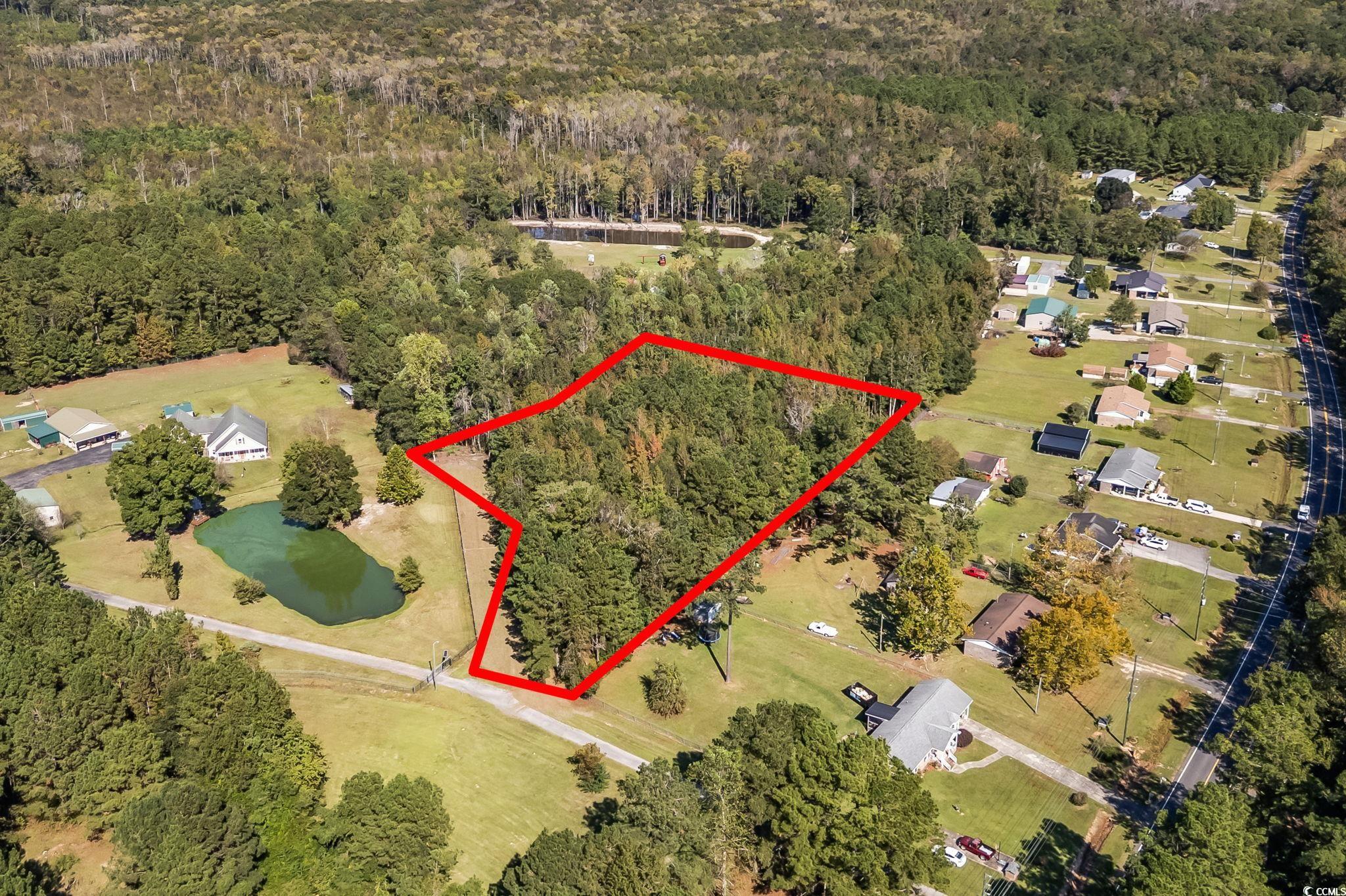 472 Highway 472 Conway, SC 29526 - Photo 5 of 30 Aerial view of property and surrounding area with a large body of water and property boundaries highlighted