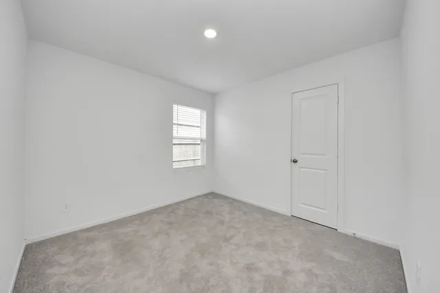an empty room with a bathroom