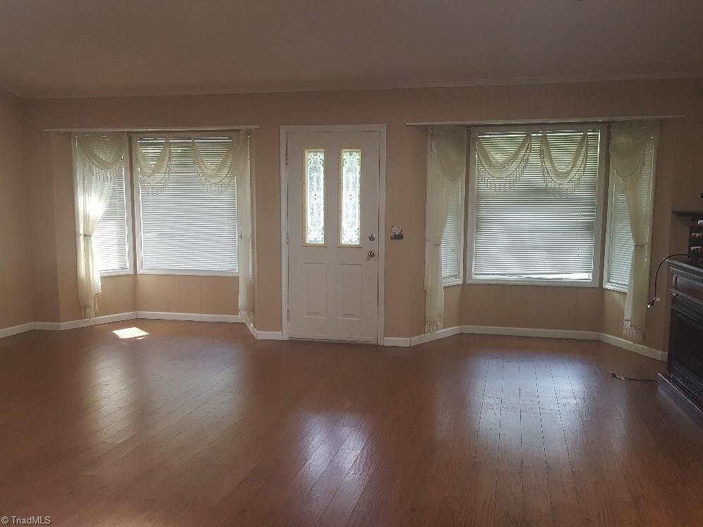 1055 Riverview Rd Extension Lexington, NC 27292 - Photo 16 of 27 Large living room with beautiful bay windows on front.
