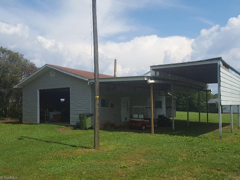 1055 Riverview Rd Extension Lexington, NC 27292 - Photo 19 of 27 HUGE garage with double carports - tons of room for all of your toys! Garage has electric, is heated and has a toilet.