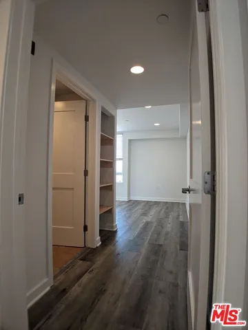 a view of an empty room and closet area