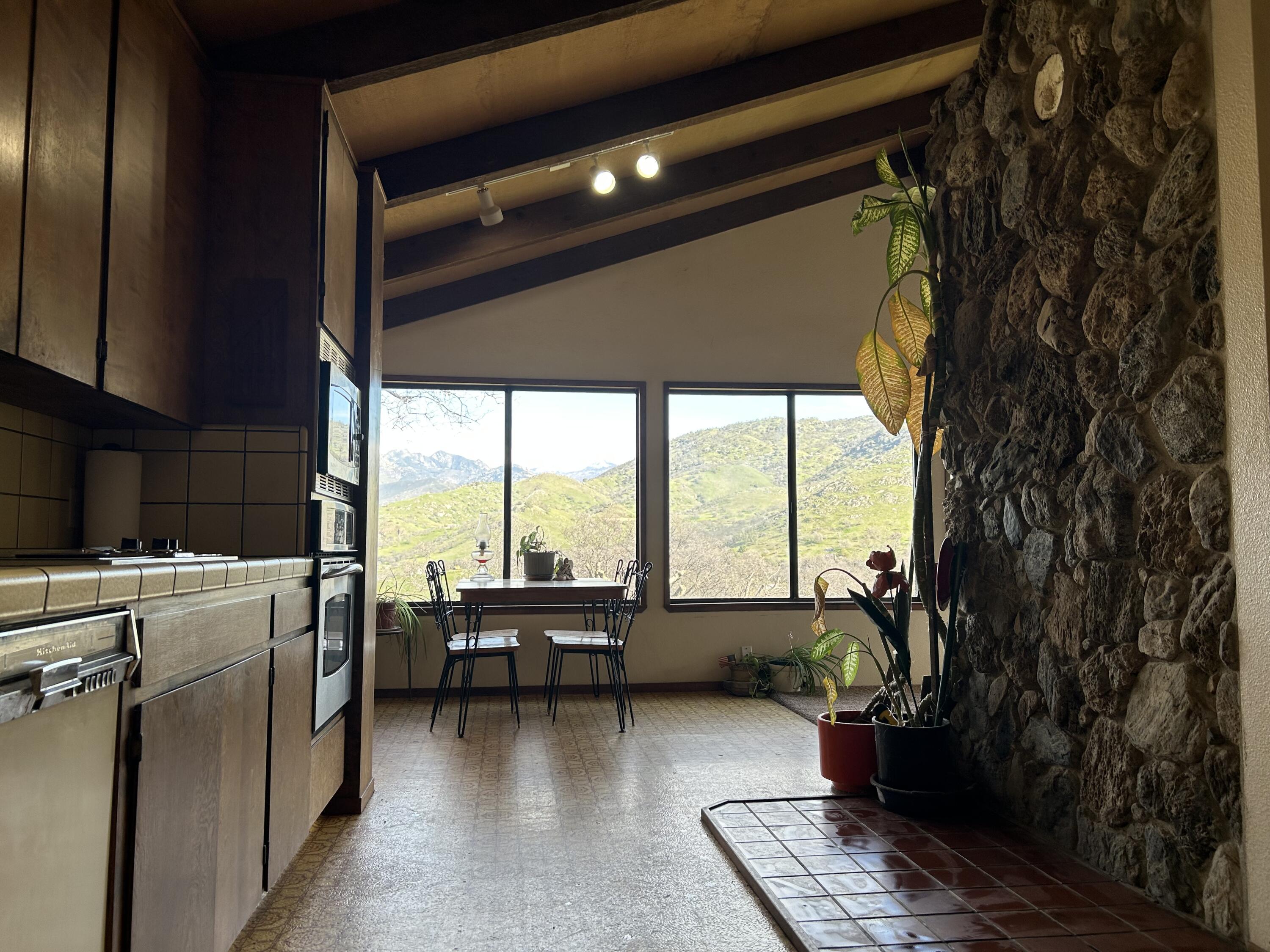 40838 Oak Ridge Drive Three Rivers, CA 93271 - Photo 15 of 51 a living room with furniture and a floor to ceiling window