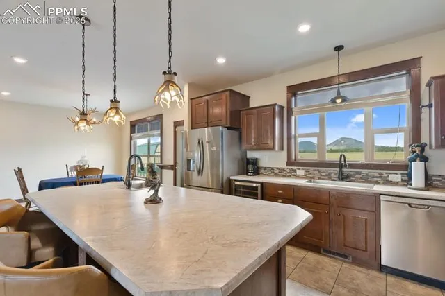 a dining table with chairs and chandelier