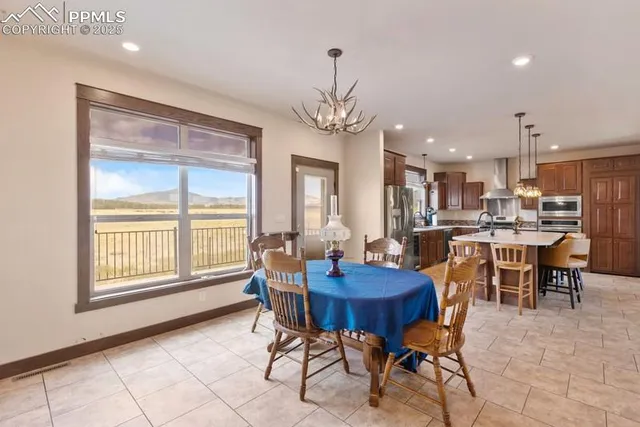 a bedroom with a bed and a lamp on dresser