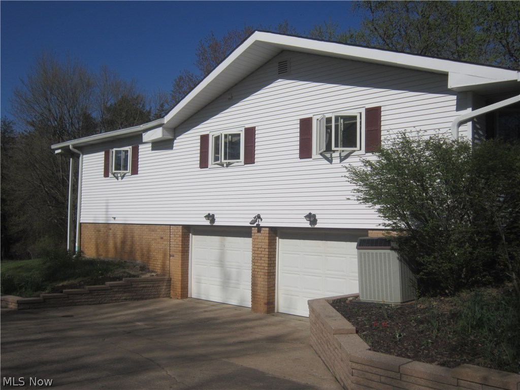 17492 Shurmer Road Strongsville, OH 44136 - Photo 13 of 17 Side view of home; entry to garage.