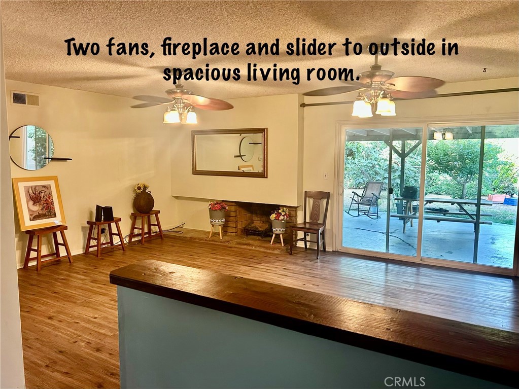 211 Benicia Road Diamond Bar, CA 91765 - Photo 5 of 36 Large Living Room has Slider to outside backyard.