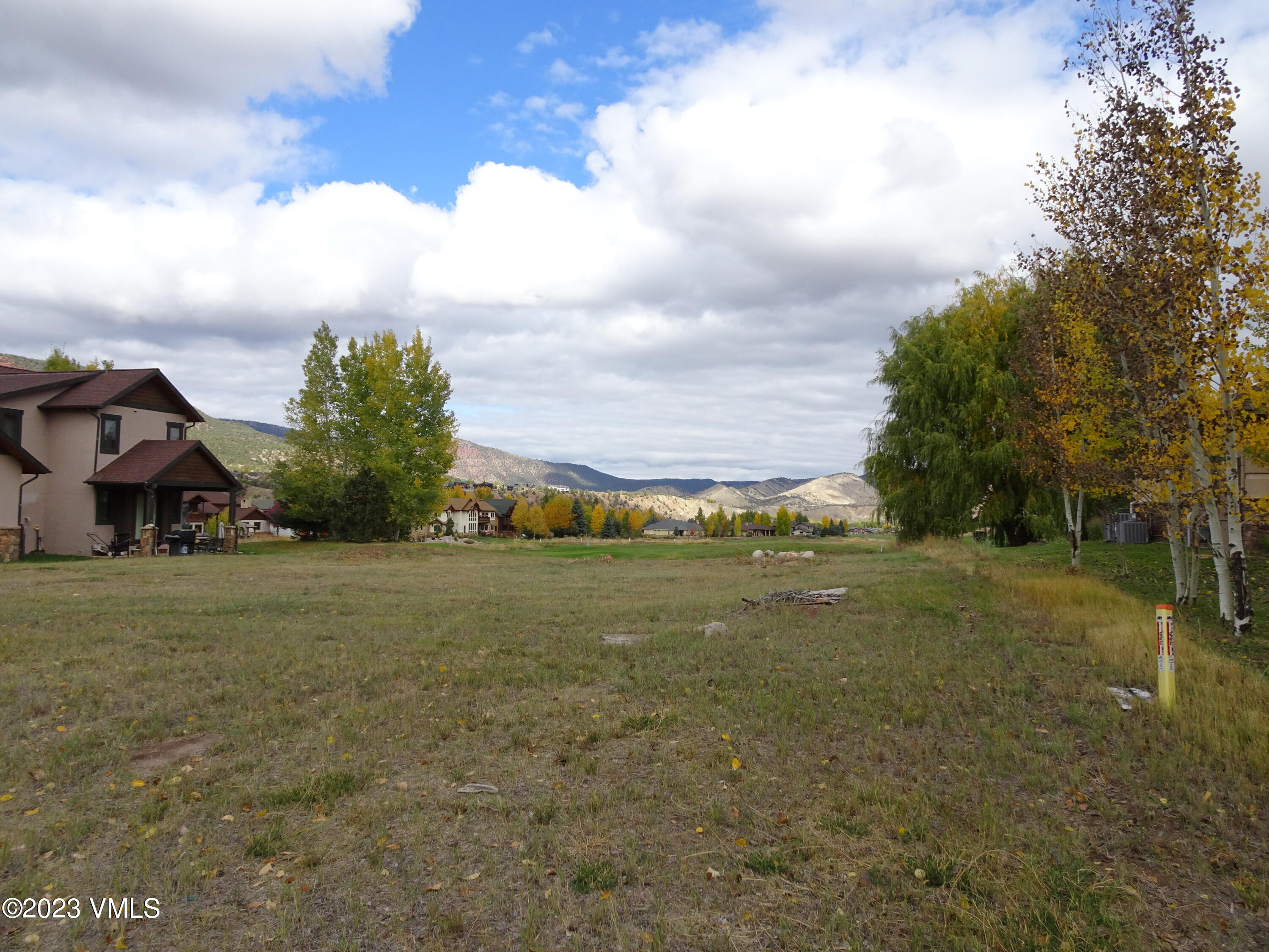 230 Timberwolf Gypsum, CO 81637 - Photo 17 of 34 a view of a big house with a big yard plants and trees