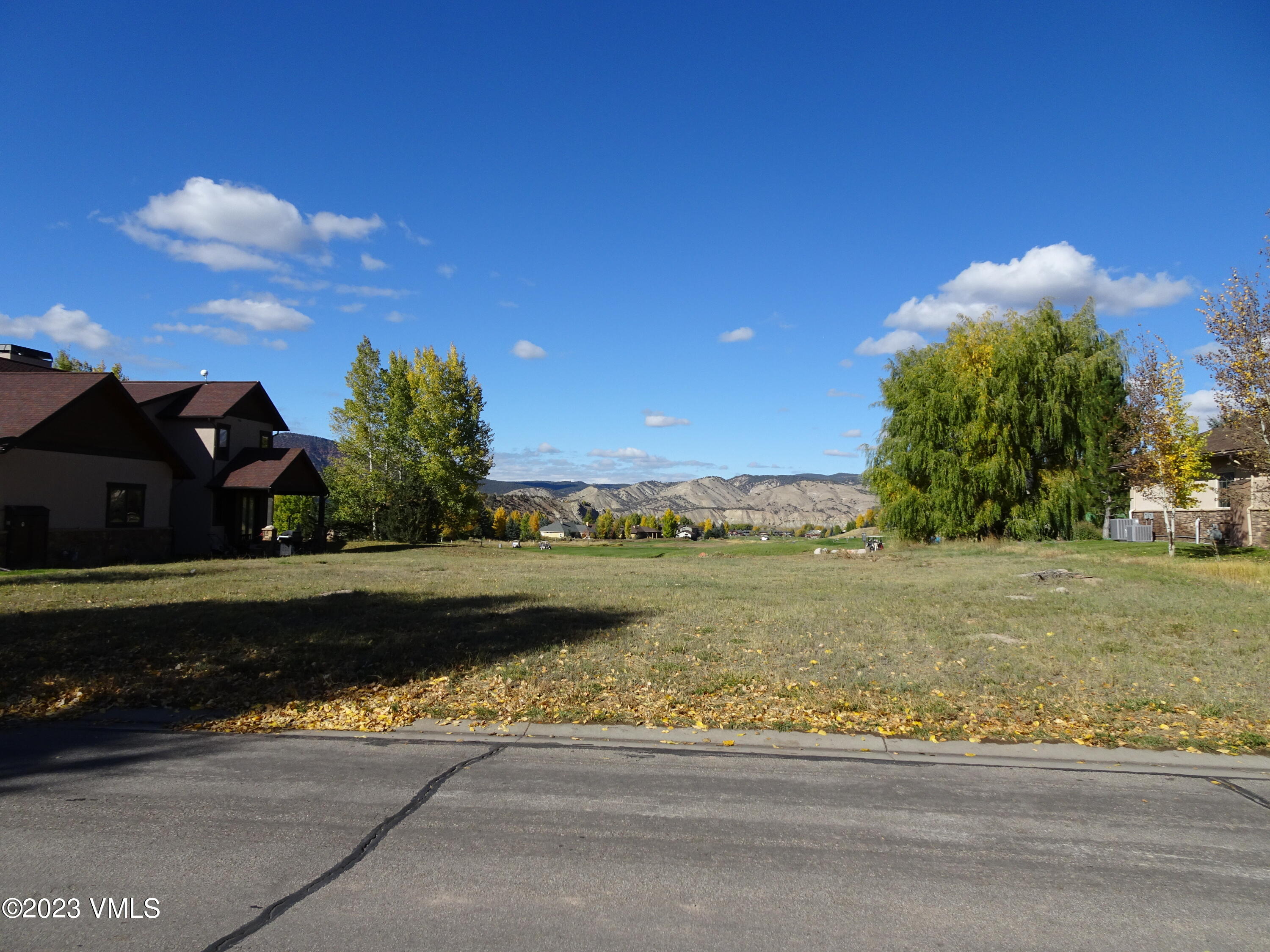 230 Timberwolf Gypsum, CO 81637 - Photo 23 of 34 a view of a lake with a house in the background
