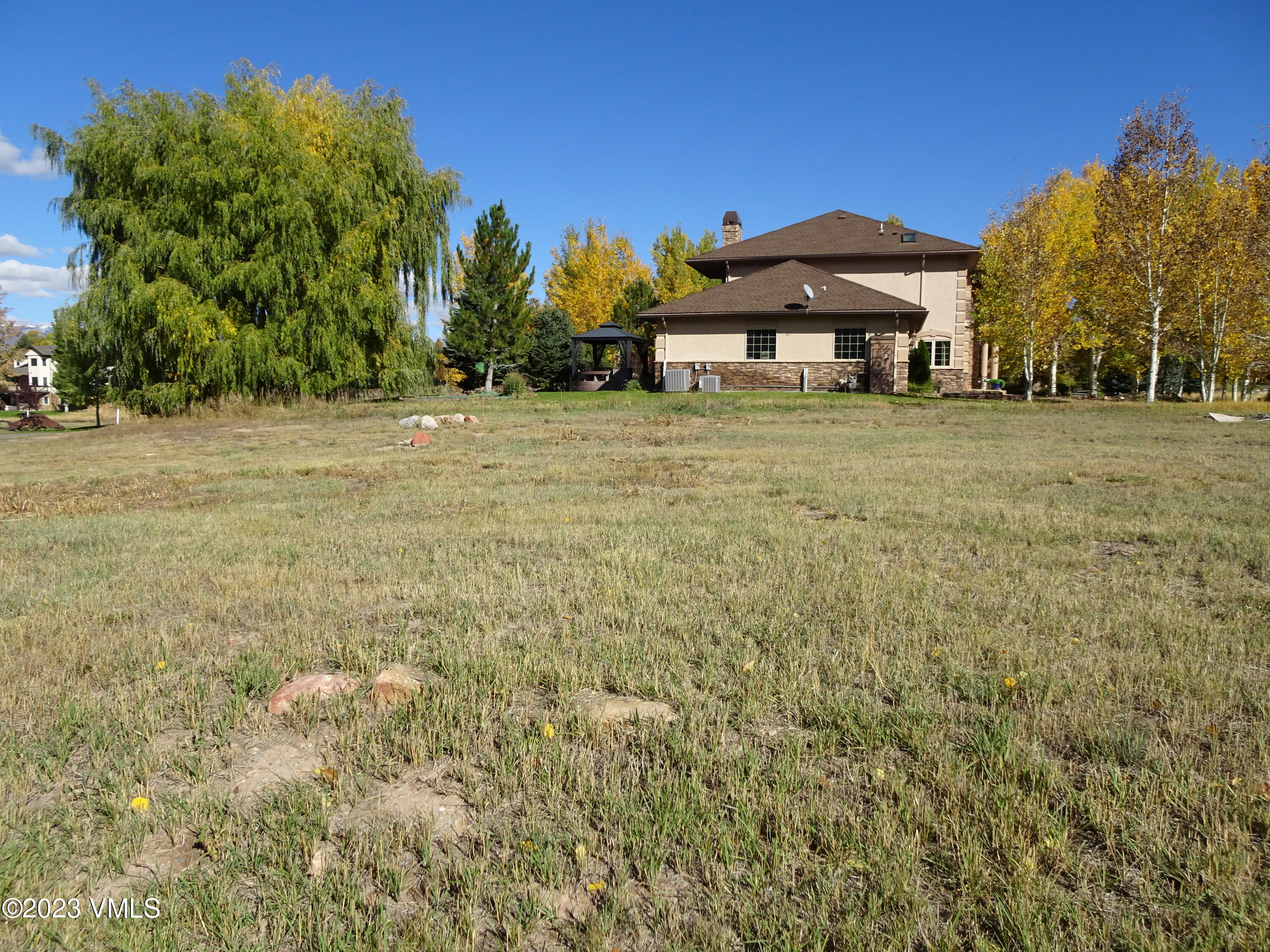 230 Timberwolf Gypsum, CO 81637 - Photo 33 of 34 a front view of a house with a yard