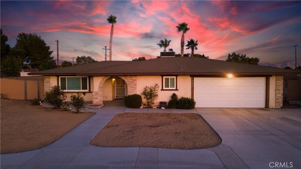 14405 Mandan Road Apple Valley, CA 92307 - Photo 1 of 1 a view of a house with backyard porch and sitting area