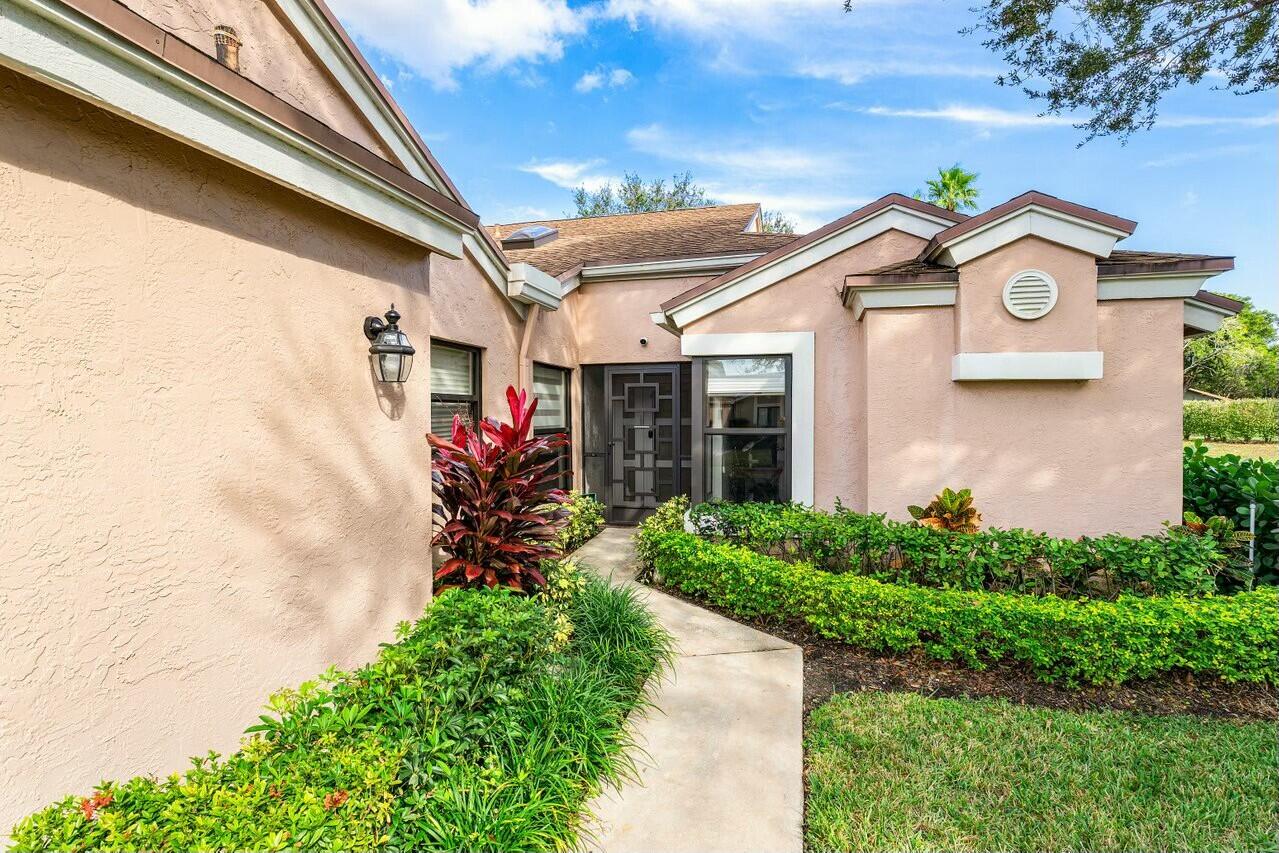 8211 Springlake Drive Boca Raton, FL 33496 - Photo 2 of 49 a front view of a house with a yard