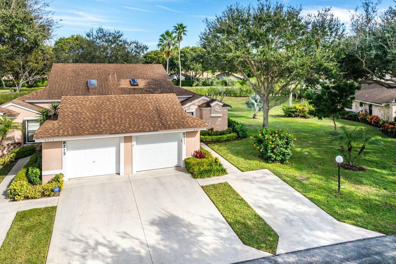8211 Springlake Drive Boca Raton, FL 33496 - Photo 3 of 49 front view of a house with yard