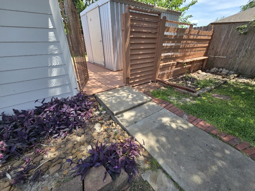 1110 Greencroft Street Channelview, TX 77530 - Photo 21 of 24 a view of a pathway with a yard