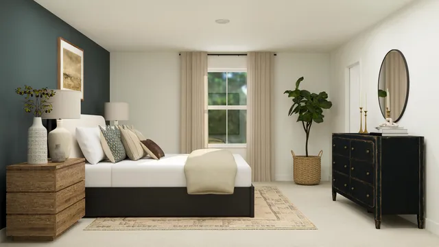 a living room with a couch and a potted plant