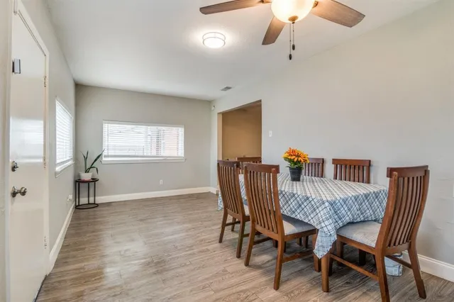 a view of a dining room with furniture and window