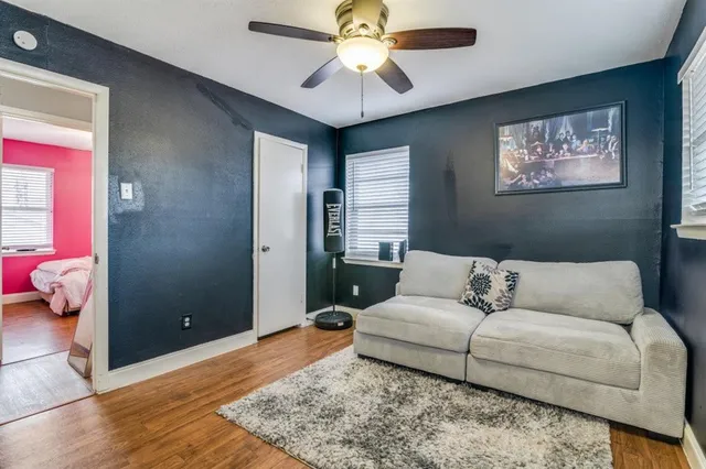 a living room with furniture and a rug