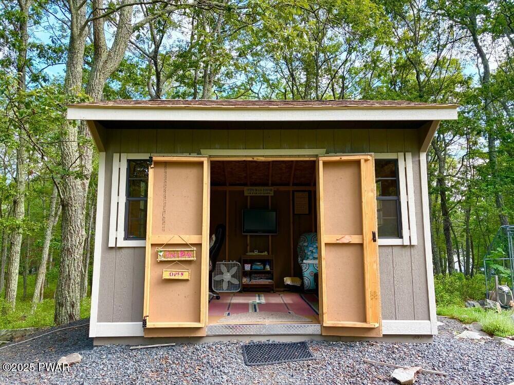 116 Maple Ridge Road Milford, PA 18337 - Photo 33 of 53 a view of a tiny house with a large window
