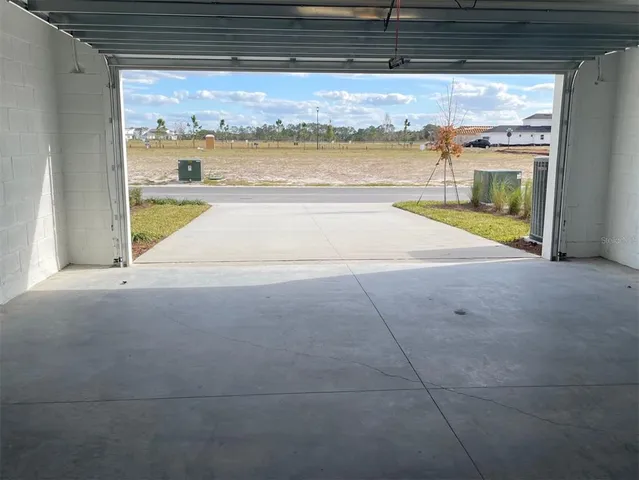 a view of a living room and floor to ceiling window
