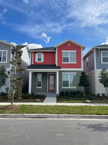 a view of a brick house with a yard