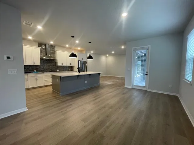 a view of kitchen with wooden floor