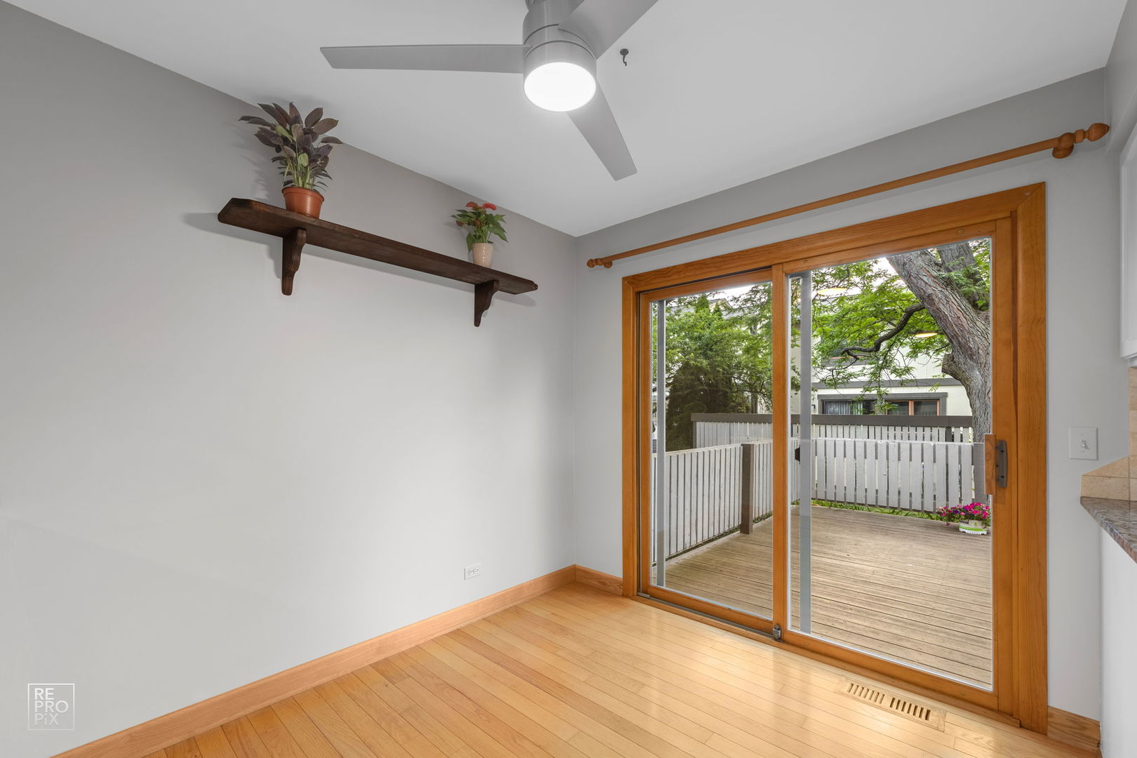 2627 Smith Street Rolling Meadows, IL 60008 - Photo 11 of 23 a view of a room with a ceiling fan and window