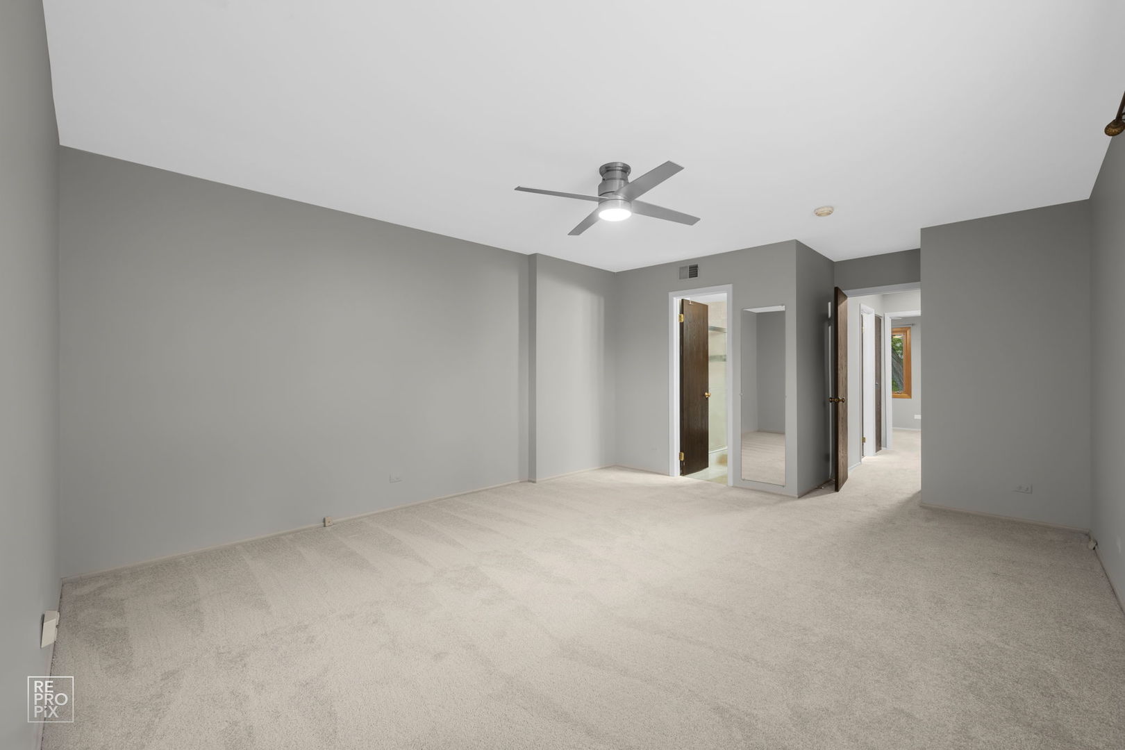 2627 Smith Street Rolling Meadows, IL 60008 - Photo 14 of 23 a view of an empty room with a ceiling fan