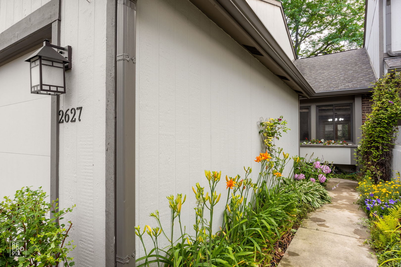 2627 Smith Street Rolling Meadows, IL 60008 - Photo 2 of 23 a front view of a house with a yard
