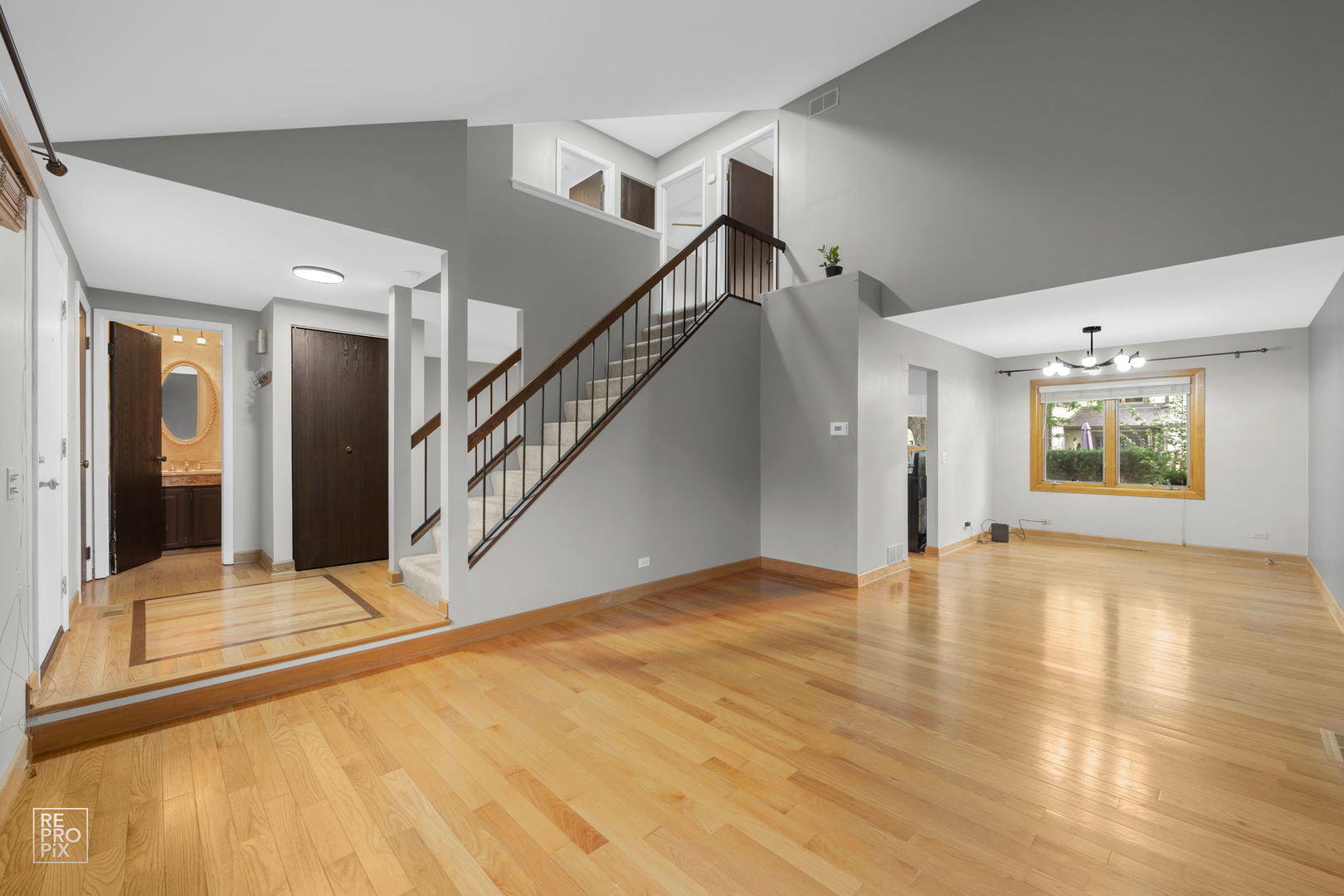 2627 Smith Street Rolling Meadows, IL 60008 - Photo 5 of 23 a view of an empty room with wooden floor and a window