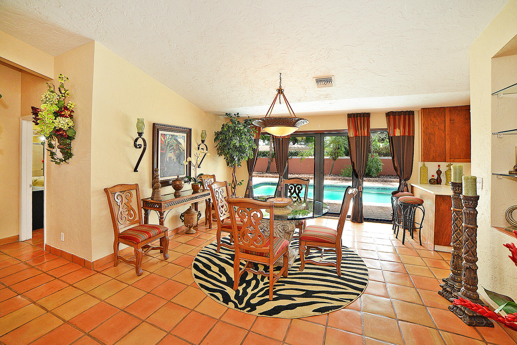 647 Northwest 12th Road Boca Raton, FL 33486 - Photo 7 of 27 a view of a dining room with furniture wooden floor and a rug