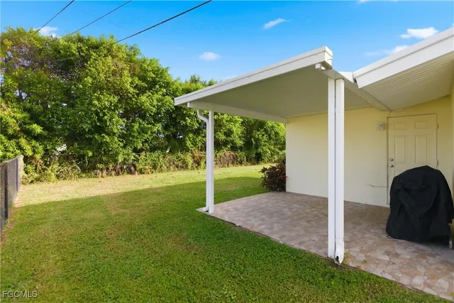 a view of a house with a big yard