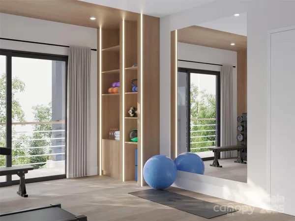 a living room with furniture and large windows