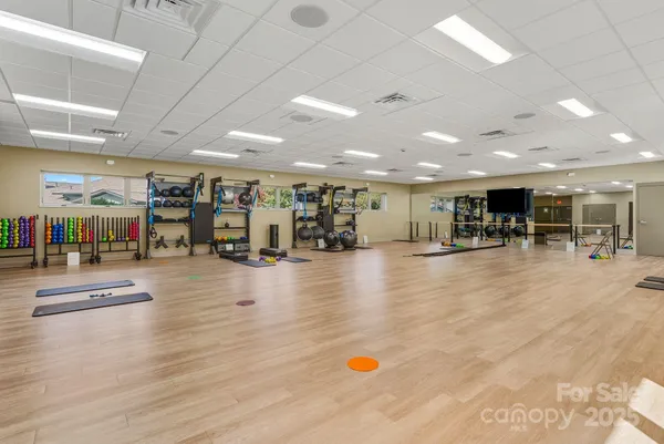 a view of a city from a balcony with furniture