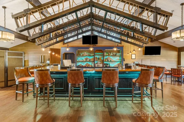 a view of a chairs and table in the patio
