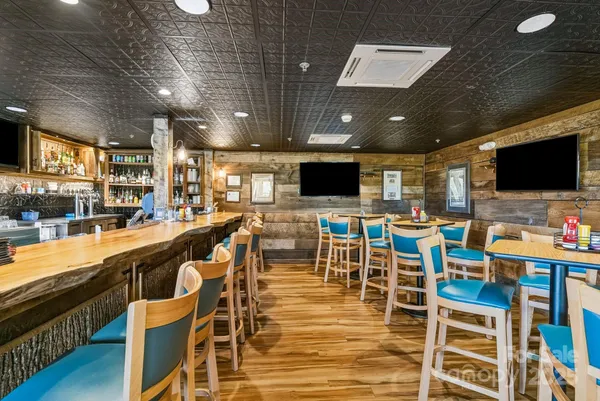 a view of a balcony with an outdoor seating