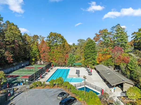 an aerial view of a house with a swimming pool