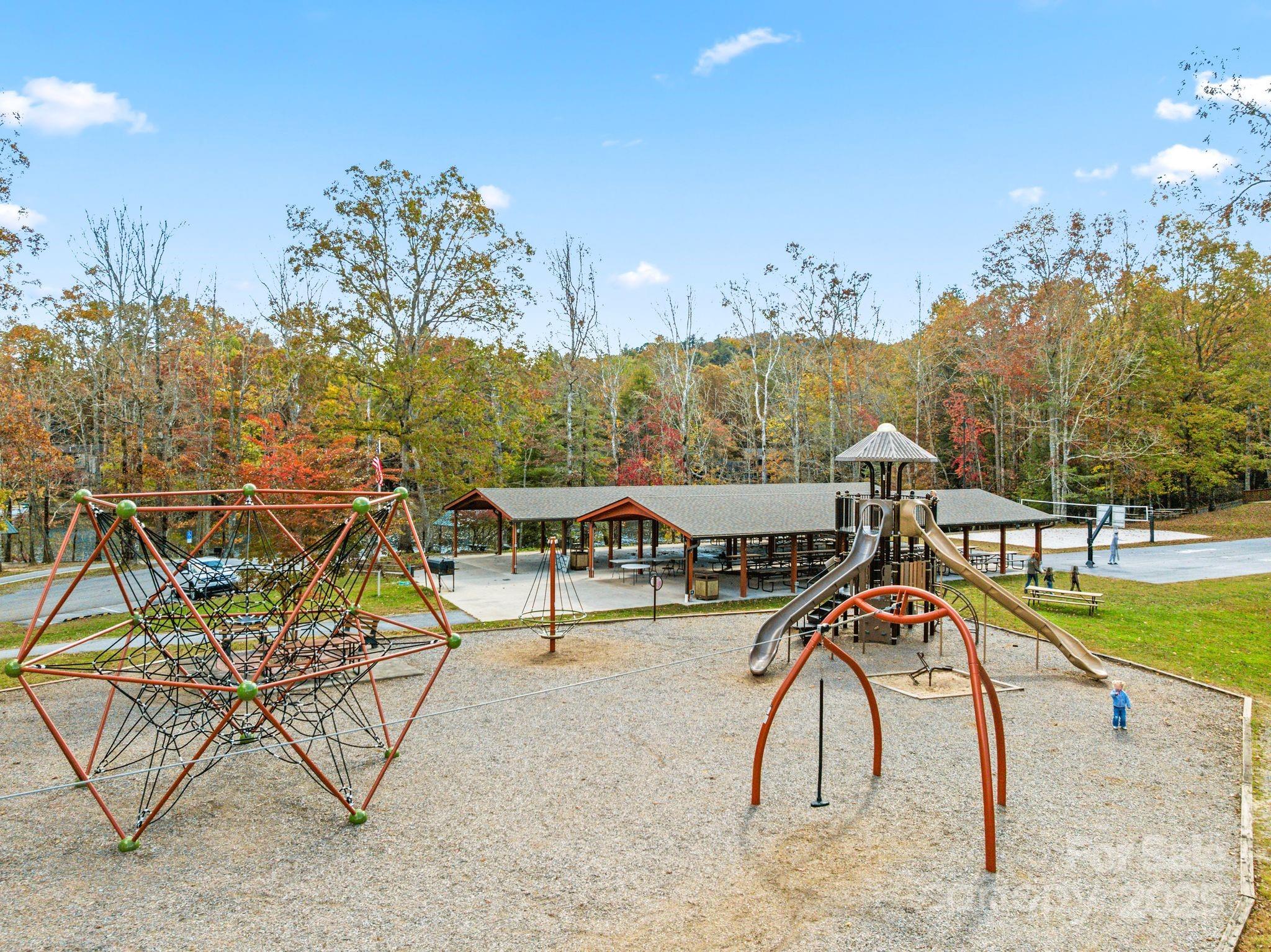 Tbd Connestee Trail Brevard, NC 28712 - Photo 45 of 48 a view of a swimming pool with a patio and dining table
