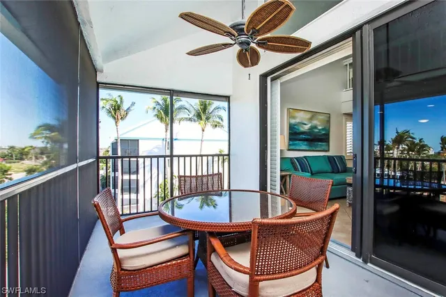 a view of a balcony with furniture