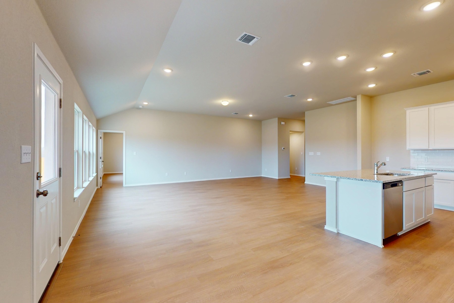 19917 Schatz Way Manor, TX 78653 - Photo 11 of 33 a view of an empty room with kitchen stove and a window