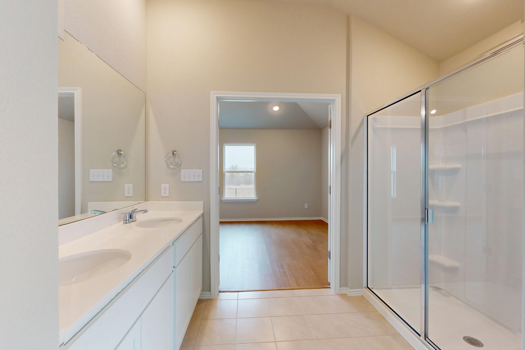 19917 Schatz Way Manor, TX 78653 - Photo 16 of 33 a bathroom with a sink a shower and a mirror